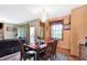 Open dining space with large windows and a connection to the living room at 4590 Turkey Track Rd, Martinsville, IN 46151