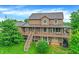Two story home with a spacious deck and lush greenery around the property at 4590 Turkey Track Rd, Martinsville, IN 46151
