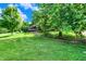 Lush lawn and mature trees surrounding the home's exterior, creating a serene landscape at 4590 Turkey Track Rd, Martinsville, IN 46151