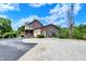 Charming two-story home with a gravel driveway and a lovely front porch in a rural setting at 4590 Turkey Track Rd, Martinsville, IN 46151