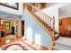Open foyer with staircase and view of the office and dining area at 4590 Turkey Track Rd, Martinsville, IN 46151