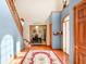 Inviting foyer with hardwood floors, staircase, and view into dining room at 4590 Turkey Track Rd, Martinsville, IN 46151