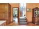 Inviting foyer with hardwood floors leads to the dining room and staircase, creating a welcoming ambiance at 4590 Turkey Track Rd, Martinsville, IN 46151