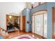 Inviting foyer with beautiful hardwood floors and decorative front door at 4590 Turkey Track Rd, Martinsville, IN 46151