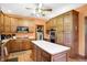 Well-equipped kitchen features an island, lots of wood cabinets, and stainless steel appliances at 4590 Turkey Track Rd, Martinsville, IN 46151