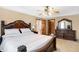 Bedroom with a tray ceiling, ceiling fan, and dresser, creating a comfortable and stylish retreat at 4590 Turkey Track Rd, Martinsville, IN 46151