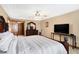 Main bedroom with a tray ceiling, ceiling fan, and closet, creating a comfortable and stylish retreat at 4590 Turkey Track Rd, Martinsville, IN 46151