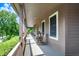 Charming, covered porch with rocking chairs, perfect for relaxing and enjoying the outdoors at 4590 Turkey Track Rd, Martinsville, IN 46151