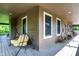 Wide, covered porch with seating, ideal for outdoor enjoyment and relaxation at 4590 Turkey Track Rd, Martinsville, IN 46151
