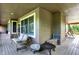Spacious porch with a swing, offering an inviting outdoor relaxation area at 4590 Turkey Track Rd, Martinsville, IN 46151