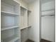 Walk-in closet with white shelving and rods, providing ample storage and organization space at 477 Mariposa Trl, Carmel, IN 46032