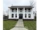 Stately two-story home with grand columns and well-maintained lawn at 477 Mariposa Trl, Carmel, IN 46032