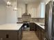 Spacious kitchen featuring modern appliances, granite countertops, and stylish pendant lighting at 477 Mariposa Trl, Carmel, IN 46032