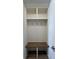 Functional mudroom area with built-in shelving, hooks, bench, and storage for organized living at 477 Mariposa Trl, Carmel, IN 46032