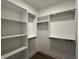 Spacious walk-in closet with custom shelving and ample storage space at 477 Mariposa Trl, Carmel, IN 46032