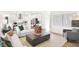 Open-concept living area featuring modern furnishings and decor and a glimpse of the bright, modern kitchen at 5052 Astor Ct, McCordsville, IN 46055