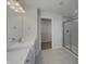 Bright bathroom featuring a glass shower, walk in closet, and a modern vanity with beautiful hardware at 649 Washington St, Fortville, IN 46040