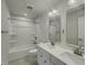 Relaxing bathroom with double sink vanity, modern finishes, and tub with shower at 649 Washington St, Fortville, IN 46040
