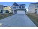 Beautiful two-story home with a well-manicured lawn, a two-car garage, and a welcoming entrance at 649 Washington St, Fortville, IN 46040