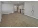 Bright open living area with soft carpeting and a staircase at 649 Washington St, Fortville, IN 46040