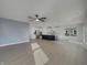 Open-concept living space featuring hardwood floors and a modern kitchen with stainless steel appliances at 649 Washington St, Fortville, IN 46040