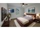 Cozy bedroom with a plush bed, stylish decor, and a ceiling fan at 649 Washington St, Fortville, IN 46040