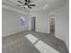 Main bedroom featuring a tray ceiling with fan and ensuite bathroom access at 649 Washington St, Fortville, IN 46040