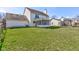 Beautiful backyard featuring lush lawn, mature trees, privacy fence, and screened in porch at 6843 Long Run Dr, Indianapolis, IN 46268
