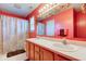 Bathroom featuring a double vanity with a large mirror and decorative accents at 6843 Long Run Dr, Indianapolis, IN 46268
