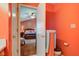 Ensuite bathroom featuring bright walls, a toilet, and a doorway to the Primary bedroom at 6843 Long Run Dr, Indianapolis, IN 46268