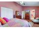 Well-decorated bedroom featuring a bed, white closet, and a door that goes into the bathroom at 6843 Long Run Dr, Indianapolis, IN 46268