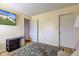 Bedroom features bright walls, mounted TV, storage and easy access to other rooms at 6843 Long Run Dr, Indianapolis, IN 46268