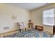 Bedroom area featuring natural light, a chair, decorative touches, and carpeted flooring at 6843 Long Run Dr, Indianapolis, IN 46268