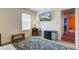 Bedroom with TV mounted on the wall, furnishings, decor, and a glimpse into the hallway at 6843 Long Run Dr, Indianapolis, IN 46268