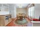Dining room with a round table, hardwood floors and stairs leading to the second level at 6843 Long Run Dr, Indianapolis, IN 46268