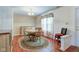 Dining room with a round table, hardwood floors, and natural light at 6843 Long Run Dr, Indianapolis, IN 46268