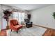 Cozy living room featuring comfortable seating, plush carpet, and bright natural light at 6843 Long Run Dr, Indianapolis, IN 46268