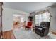 Cozy living room leading into a dining area, plush carpet and comfortable seating at 6843 Long Run Dr, Indianapolis, IN 46268