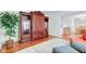 Cozy living room leading into a dining area, with hard wood floors and a beautiful cabinet at 6843 Long Run Dr, Indianapolis, IN 46268