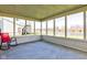 Relaxing screened porch with views of the landscaped yard and a serene pond at 6843 Long Run Dr, Indianapolis, IN 46268