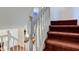 Interior shot of a staircase with white railings and carpeted steps at 6843 Long Run Dr, Indianapolis, IN 46268