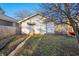 Backyard featuring a detached garage with a small awning, offering a private outdoor space with parking at 741 N Linwood Ave, Indianapolis, IN 46201