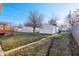 Fenced backyard with green space, alley access and a detached garage, perfect for outdoor activities and parking at 741 N Linwood Ave, Indianapolis, IN 46201