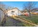 A view of the backyard with green space, featuring a detached garage, offering a private outdoor space at 741 N Linwood Ave, Indianapolis, IN 46201