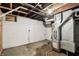 Spacious unfinished basement with concrete walls, and exposed ductwork, offering a blank canvas for renovation at 741 N Linwood Ave, Indianapolis, IN 46201