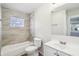 Updated bathroom with tiled shower/tub combination and modern fixtures at 741 N Linwood Ave, Indianapolis, IN 46201
