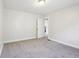 Bedroom with neutral carpet, one white door and natural light at 741 N Linwood Ave, Indianapolis, IN 46201
