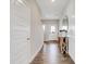 Inviting entryway with wood floors, shiplap accent wall, and a decorative console table at 7512 Manor Lake Ln, Indianapolis, IN 46268