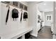 Inviting entryway with coat hooks, bench, and storage, offering a functional and stylish welcome area at 7523 Fallsworth Dr, Avon, IN 46123