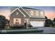 Beautiful two-story home with a brick facade and a two-car garage at 7523 Fallsworth Dr, Avon, IN 46123